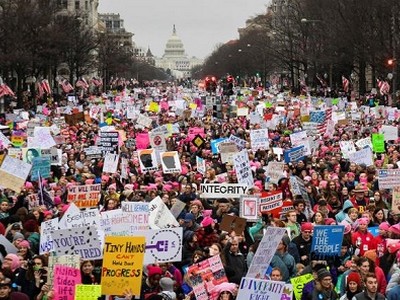 Hundreds of thousands march down Pennsylvania Avenue during the Women's March. REUTERS/Bryan Woolston